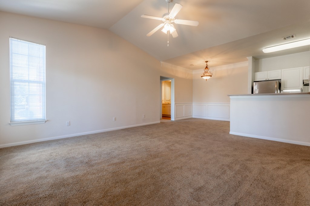 Living room with window light and ceiling fan and lights2 at Wynnewood Farms Apartments, Overland Park, Kansas