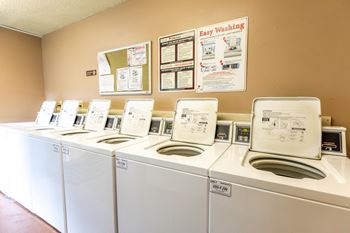 A row of washing machines in Bristol Pointe's laundry facility.