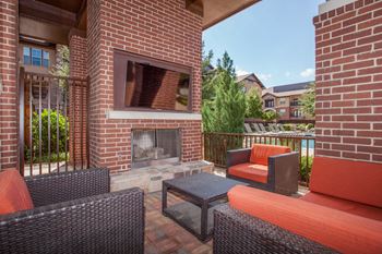 outdoor fireplace and tv at  Cypress at Lewisville Apartments , Lewisville