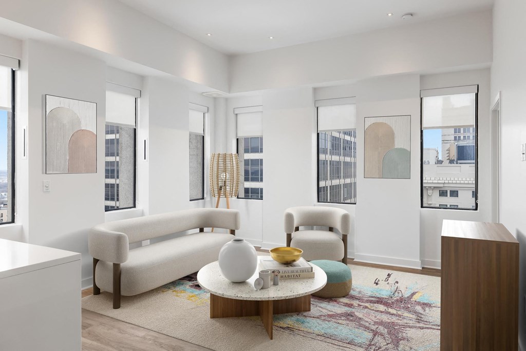 Living room with couch and table at Sky On Main Apartments, Missouri City, MO