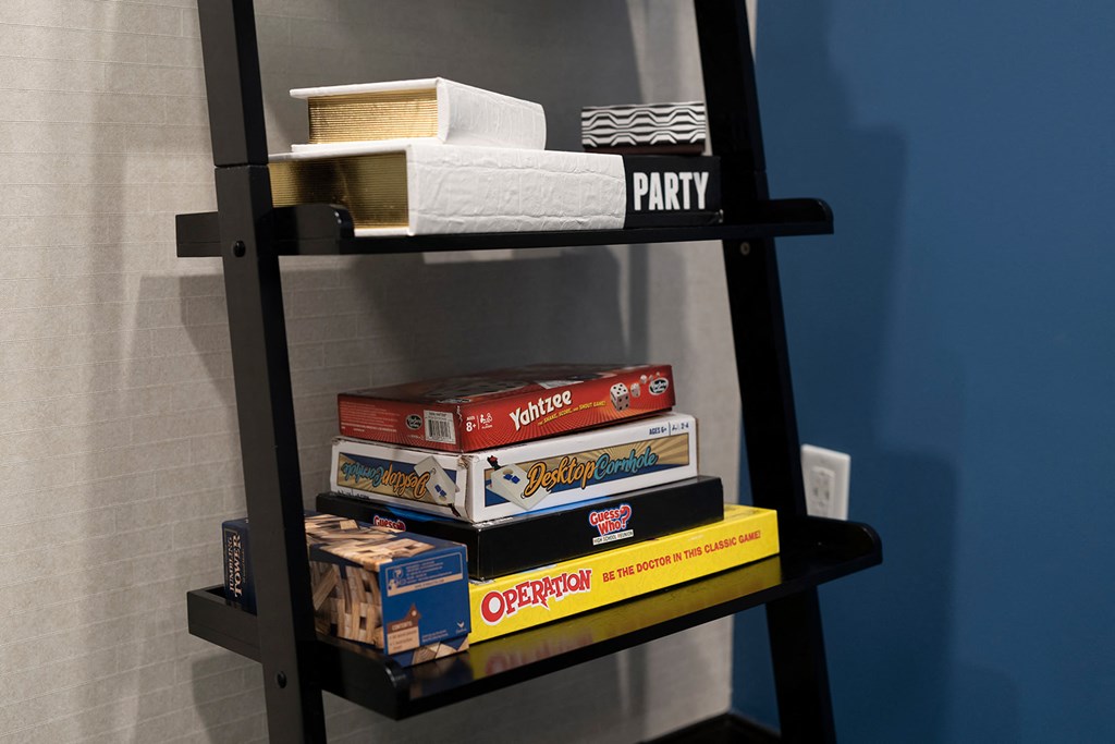 board games in the game room at Sky On Main Apartments, Missouri City, MO, 64105
