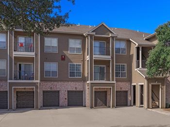 Building exterior with wooden color at The Clairborne Apartment Homes, Grand Prairie, TX, 75050