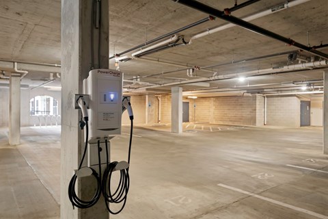 Electric vehicle charging station in The Dorset parking garage for resident use