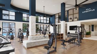 a workout room with a white couch and various exercise equipment