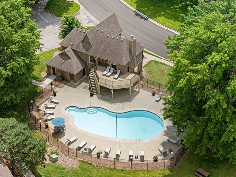 A house with a pool in the backyard.