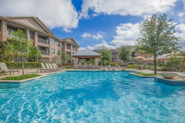 blue pool at Ovation at Lewisville Apartments, Lewisville, TX - Photo Gallery 3