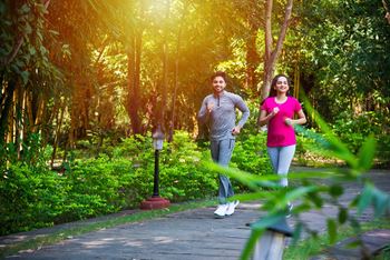 a couple jogging in a park at Stonebriar Apartments, Kansas, 66213