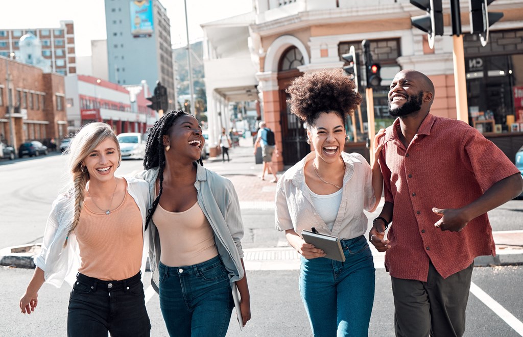 a group of people walking down a city street