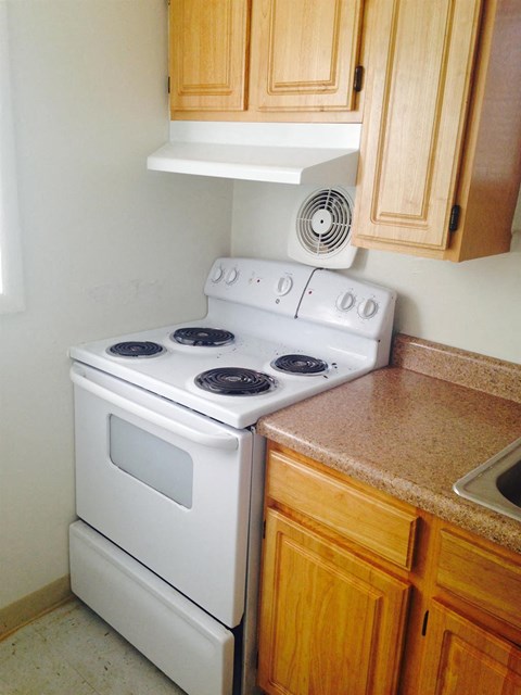 a kitchen with a stove and a sink
