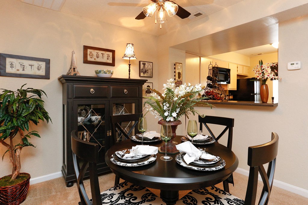 the view of a dining room with a table and chairs
