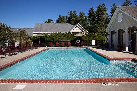 A pool with a 3 feet sign in front of it.