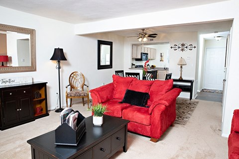 a living room with a red couch