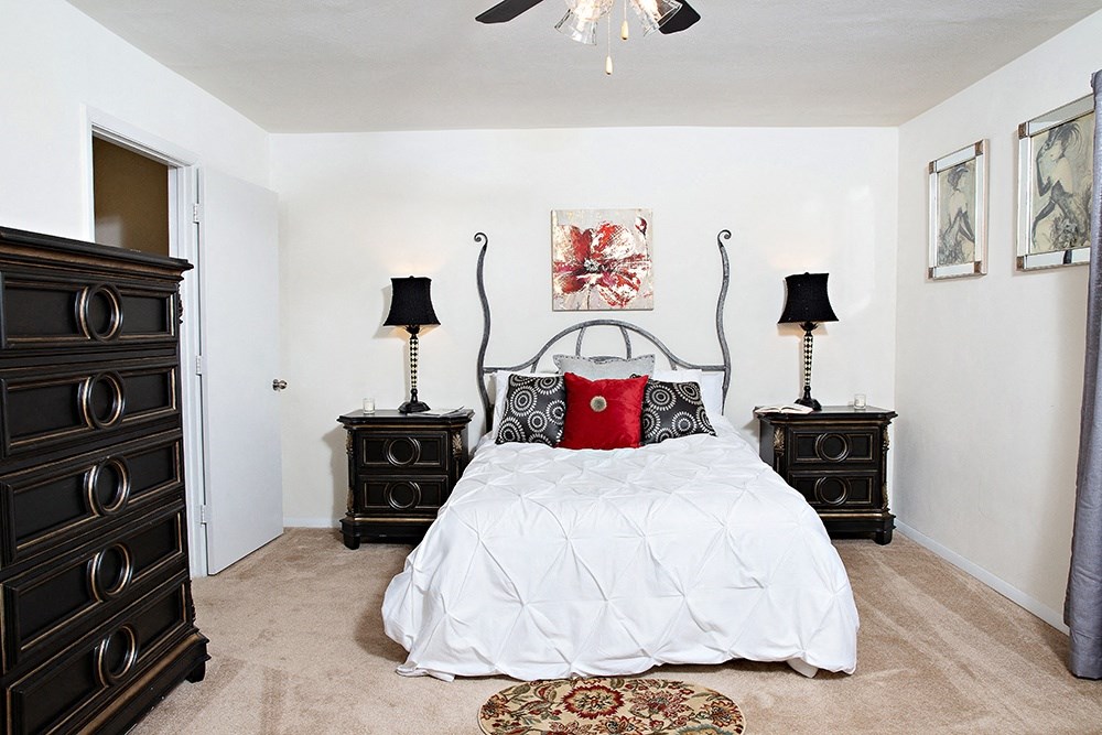 a bedroom with a bed and two night stands