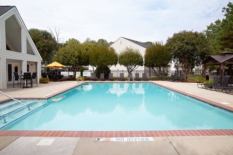 A pool with a diving sign on the side.