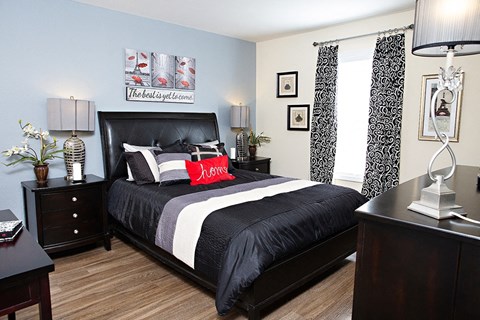 Bedroom with accent wall and queen size bed