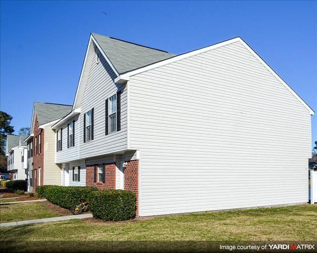 a white house with a gray roof