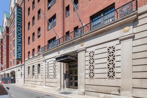 a large brick building with a sign on the front of it