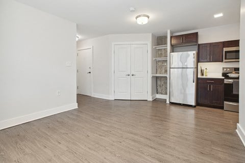 a kitchen and living room in a two bedroom apartment