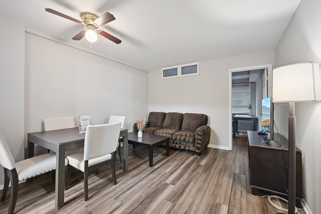 a living room and dining room with a couch and a table