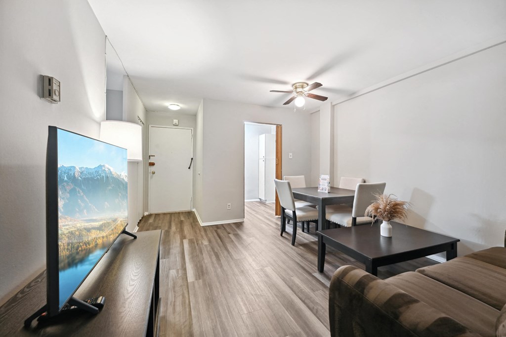 a living room with a couch and a table with a tv