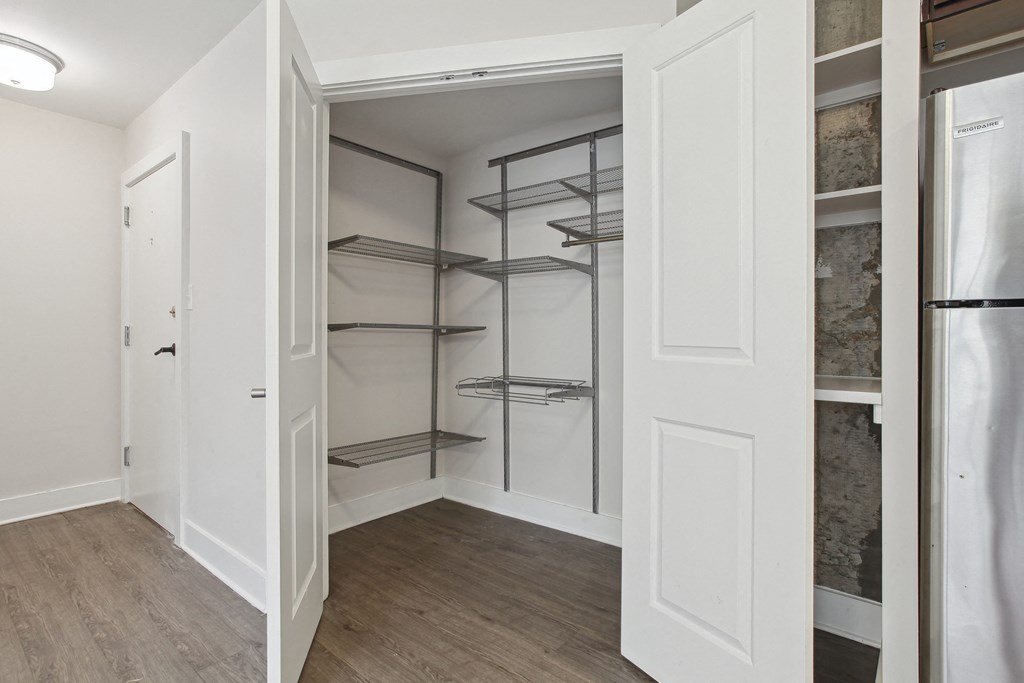 a walk in closet in a 555 waverly unit