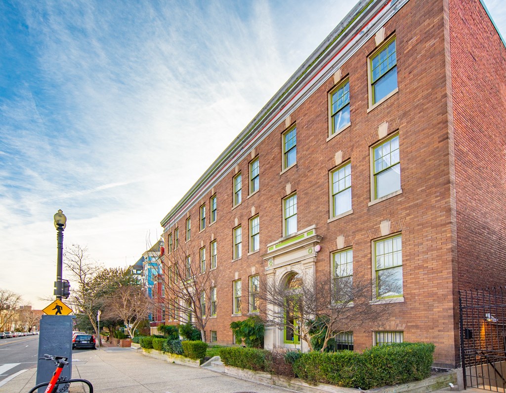 a brick building with a bike parked in front of it