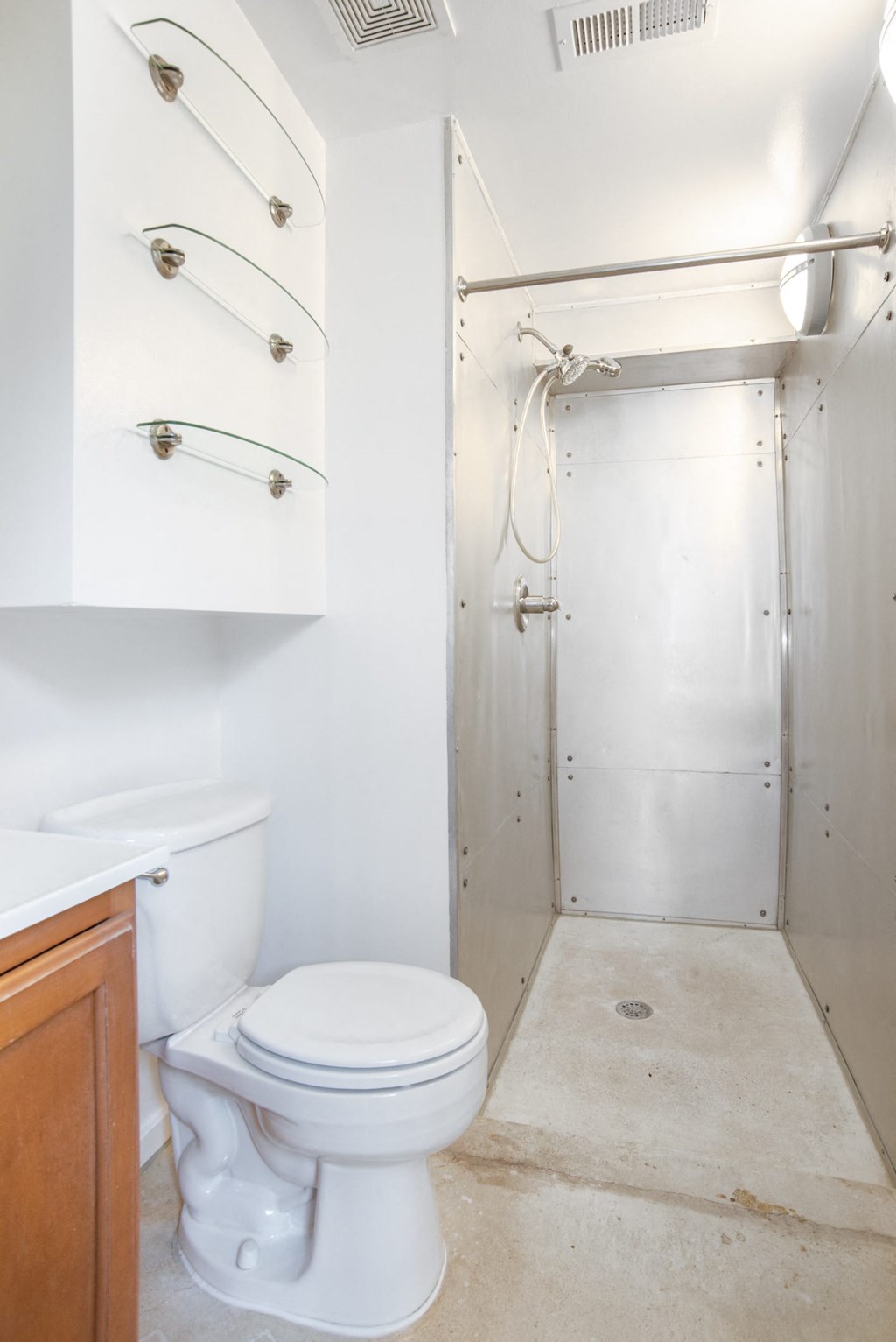 a small bathroom with a toilet and a shower