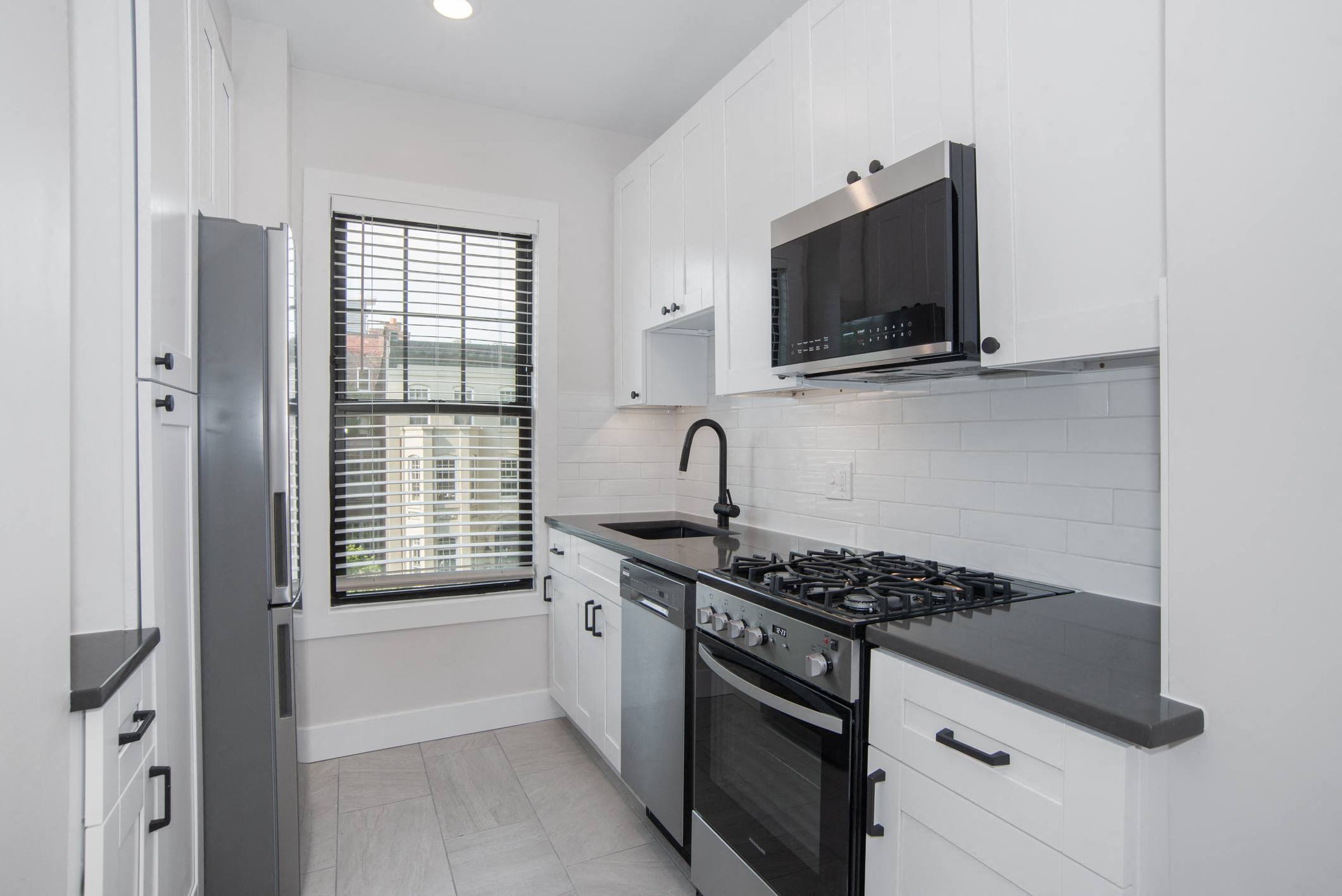 a kitchen with a stove and a microwave