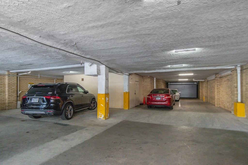 a parking garage with cars in it