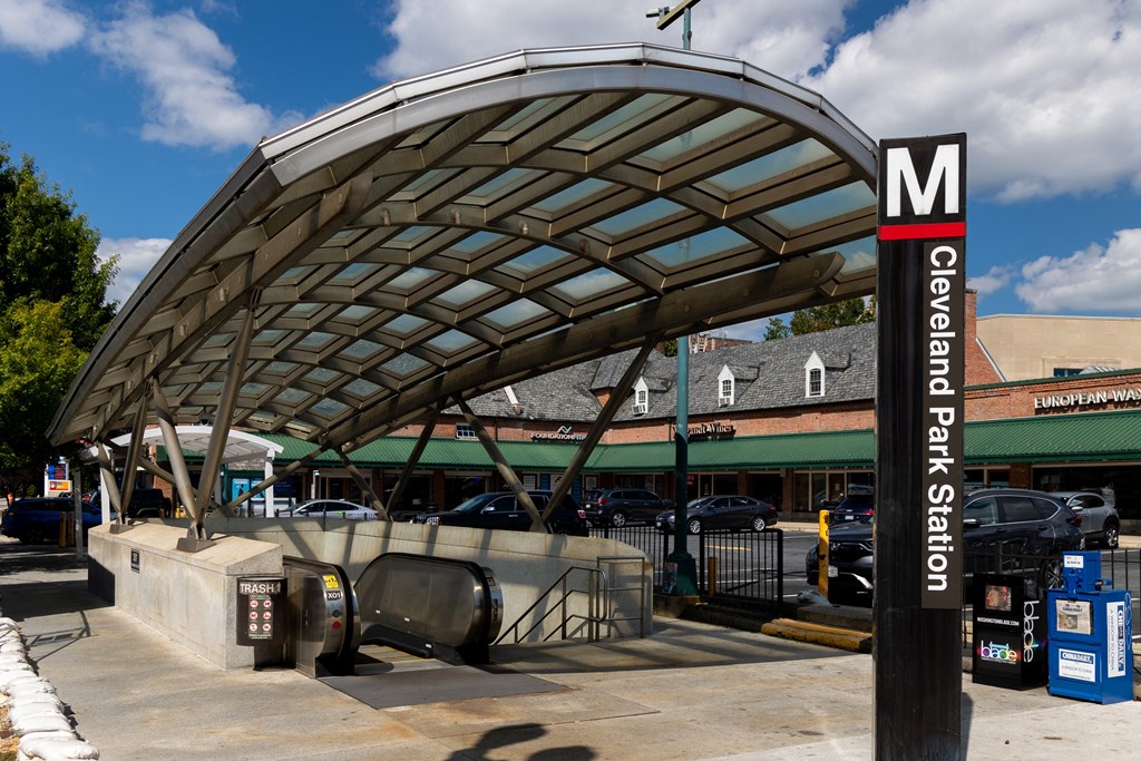 a gas station with a canopy over a parking lot