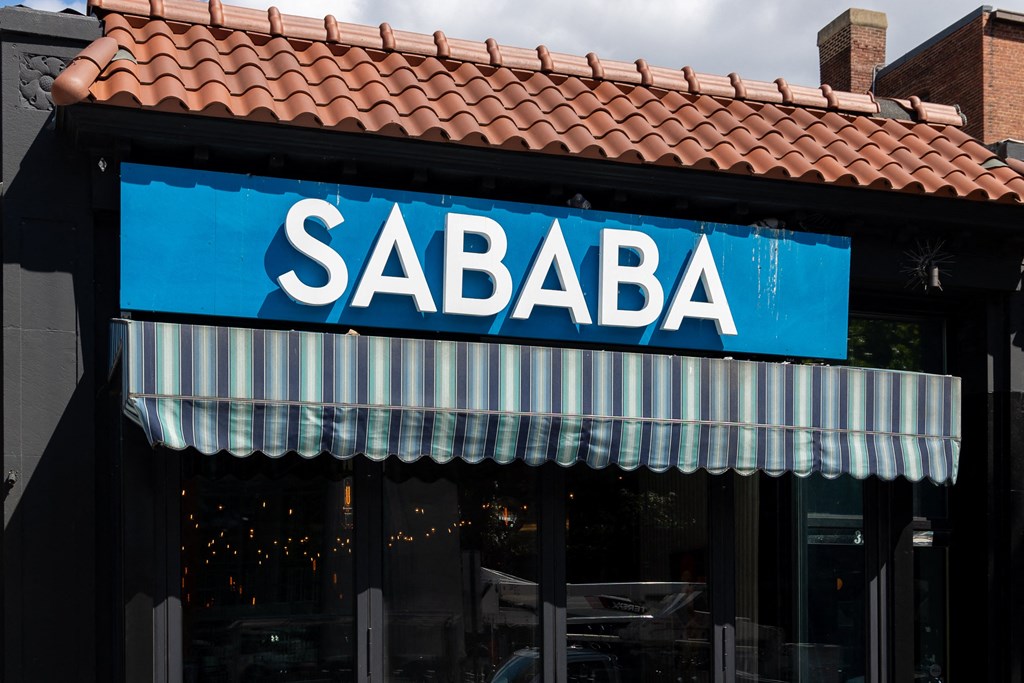 the front of a restaurant with a blue sign that reads sabba