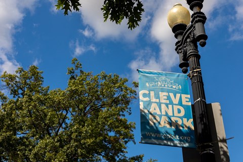 a sign on a street light