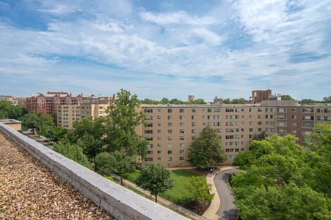 A view of a city with buildings and a road.