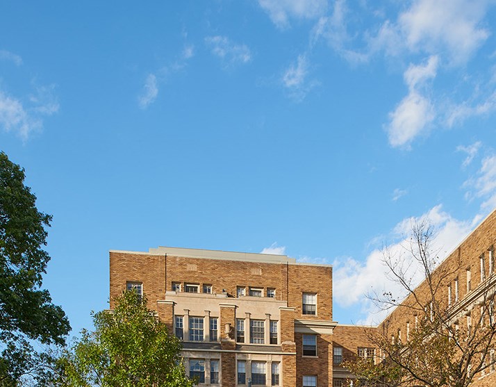 a large brick building on the corner of a street