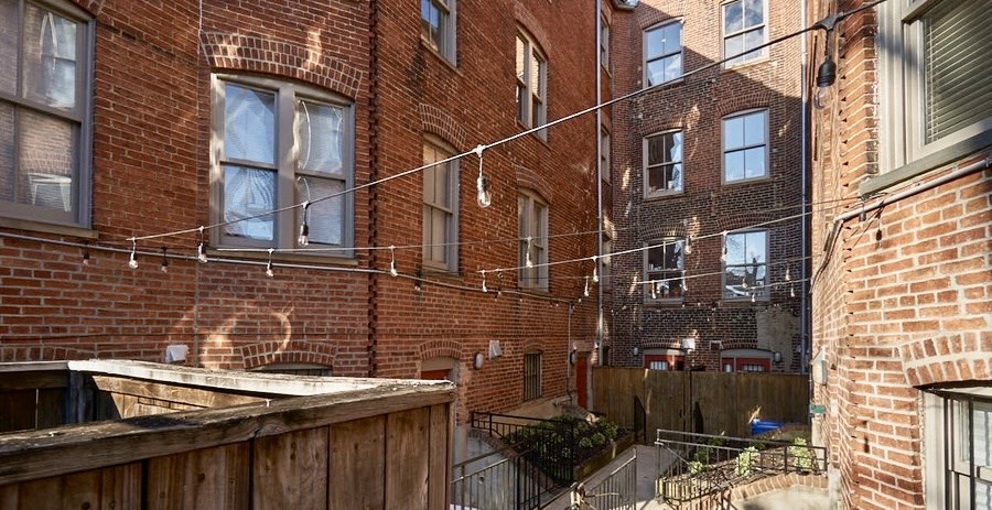 a brick building with a shadow on the side of it