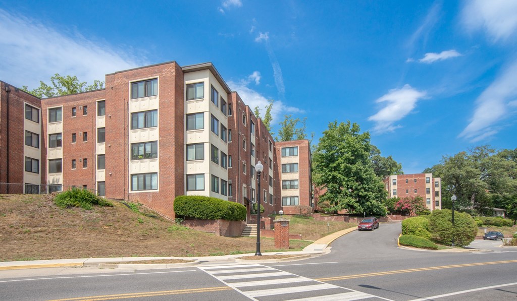 an apartment building on the corner of a street