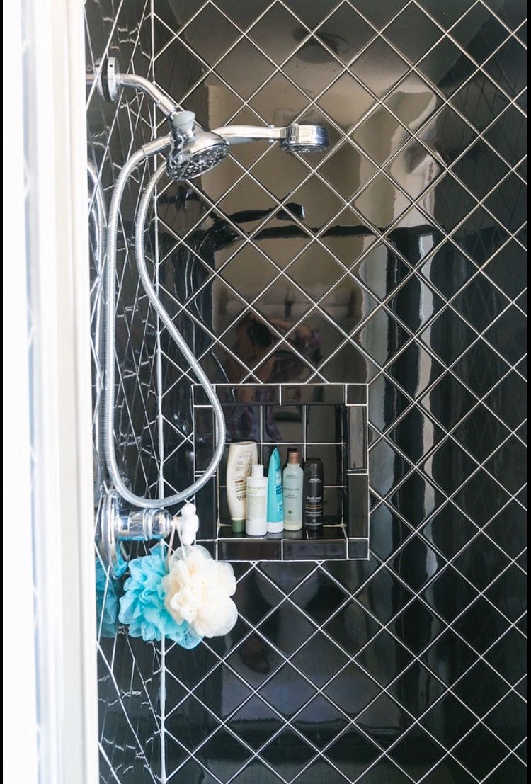 a shower in a bathroom with a chain link