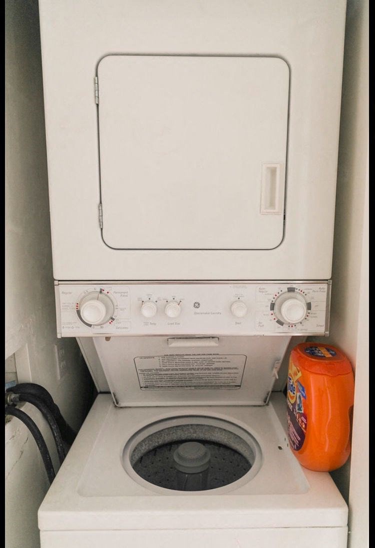 a washer and dryer in a small washing machine