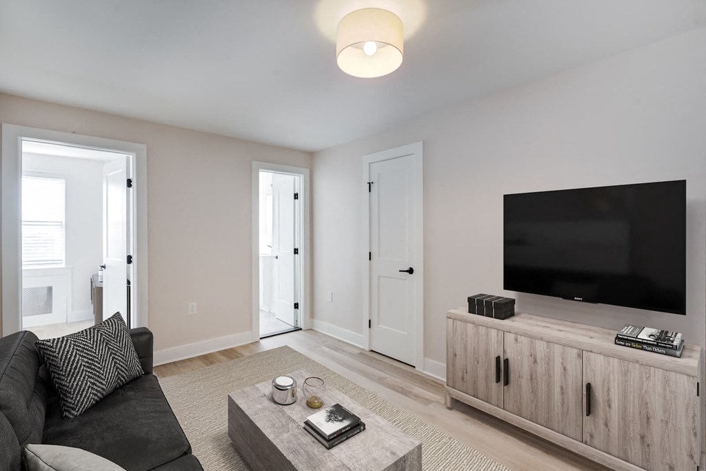 a living room with a couch and a tv