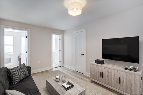 a living room with a couch and a tv