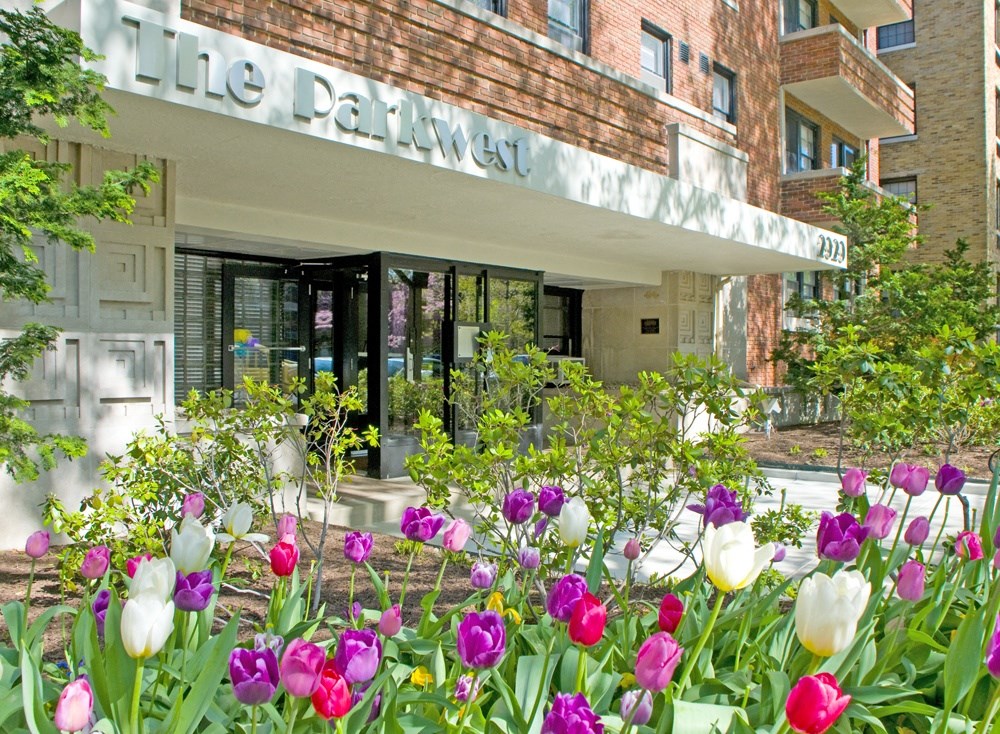 a flower garden in front of a building