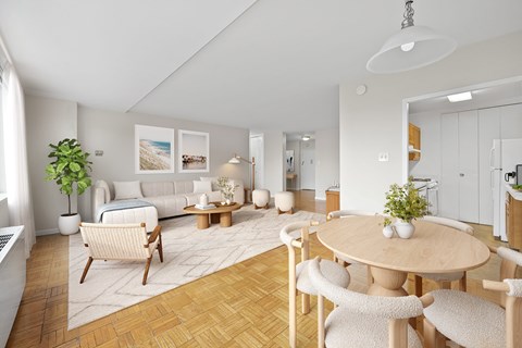 A living room with a couch, chairs, and a coffee table.