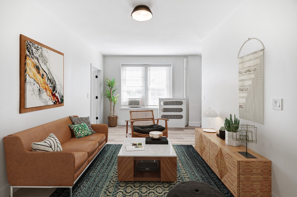 a living room with a brown couch and a coffee table