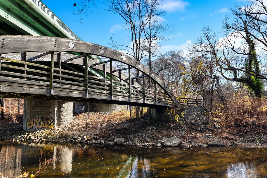 a bridge over a river on a sunny day