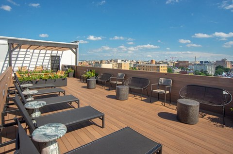 a roof top patio with a view of the city