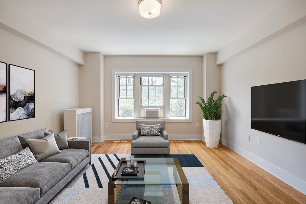 a living room with a couch and a coffee table and a tv