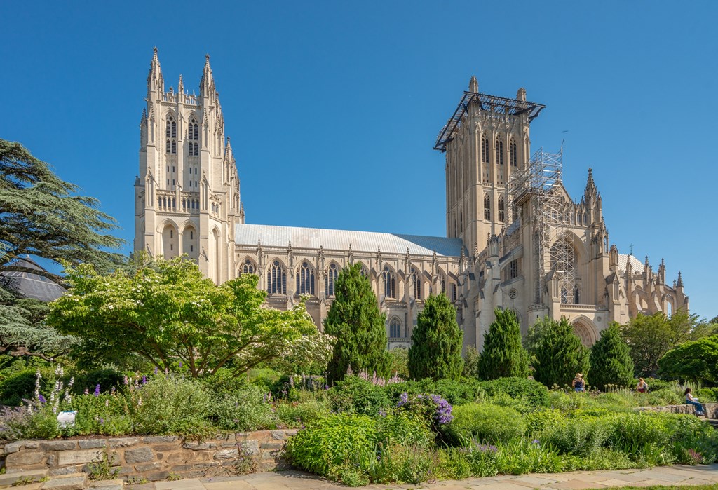 a cathedral with a garden in front of it