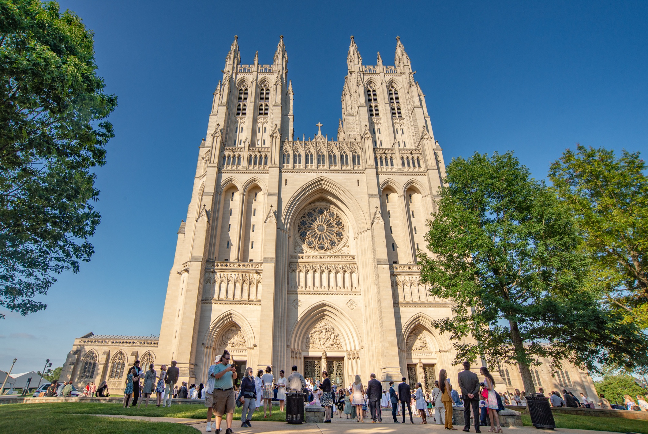 people standing in front of the cathedral of notre dame