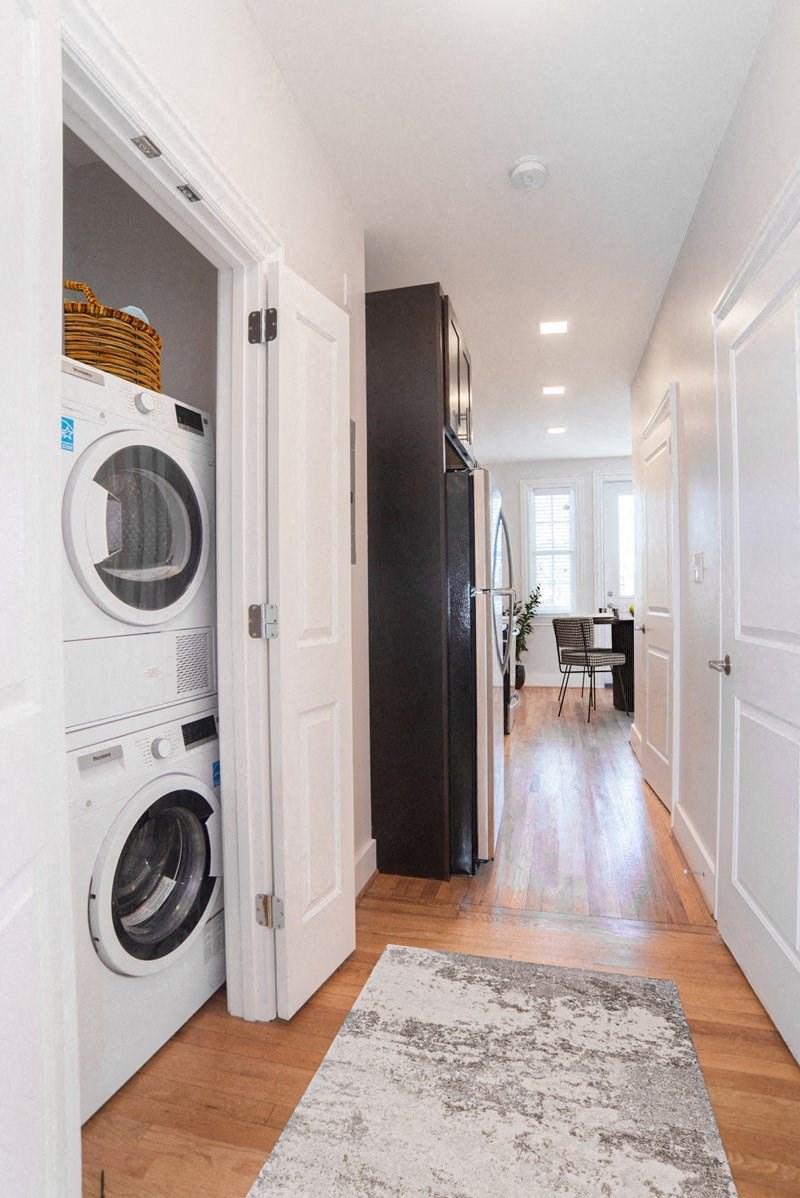 a small laundry room with a washing machine and a dryer