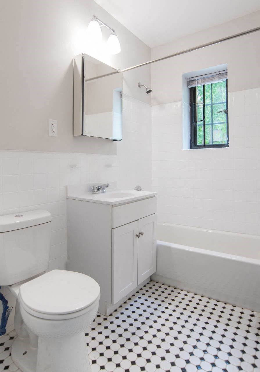 a bathroom with a toilet and a sink